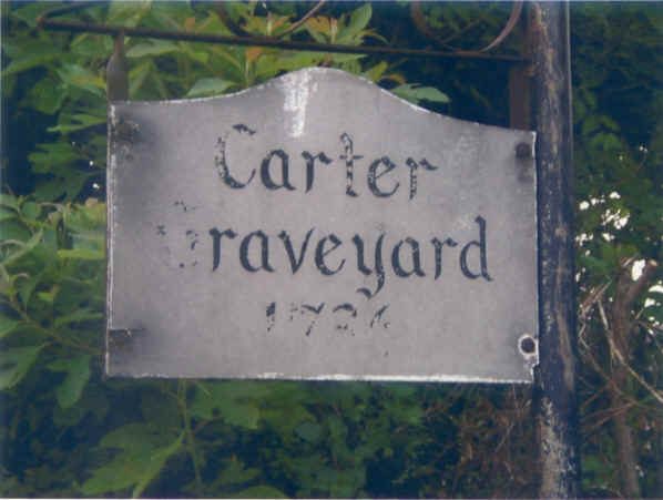 Weathered wooden sign reading Carter Graveyard 1736