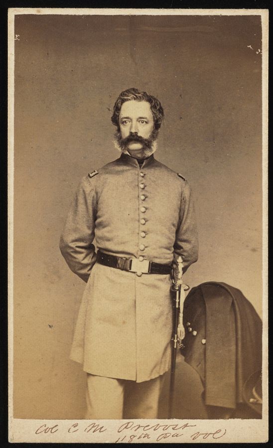 Carte-de-visite portrait of Charles Mallet Prevost in uniform with sword